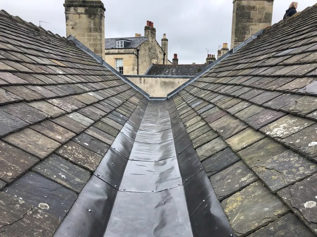 Lead-lined valley gutter between two slate roof slopes