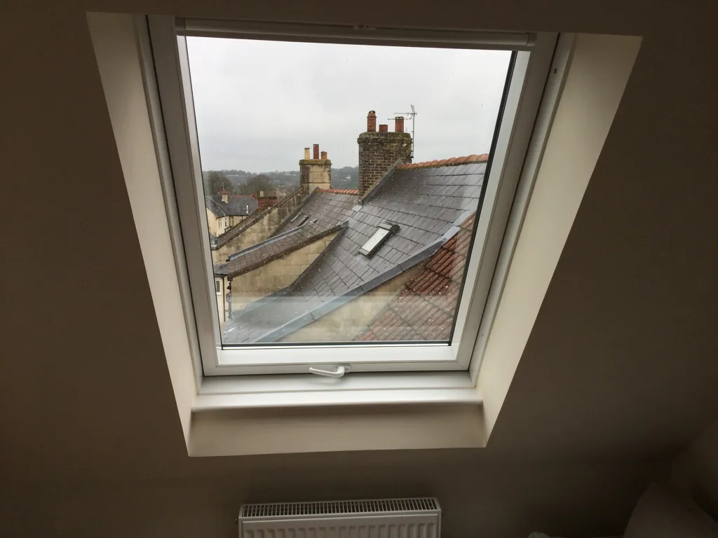 White roof window seen from inside a loft room